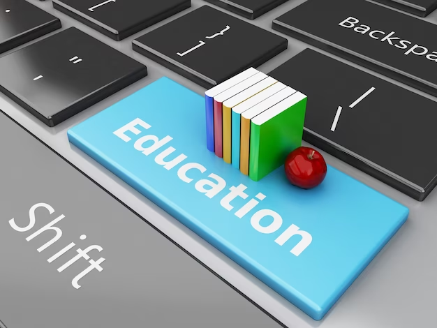 A 3D image of books placed on a computer keyboard, with the word "Education" written on them.