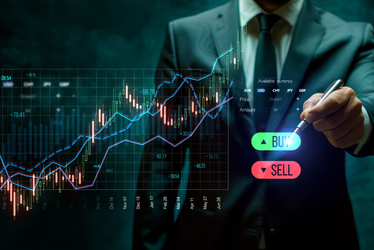Business professional in a suit using a digital trading interface with candlestick charts, trend lines, and buy/sell buttons, representing trading indicators vs price action strategies in financial markets.