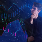 Trader analyzing global Forex market trends and economic charts